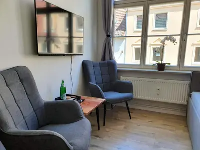Ein Sitzbereich in der Unterkunft Hogulu - klein und fein in der Altstadt, Appartement 10