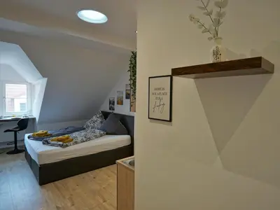 Ein Bett oder Betten in einem Zimmer der Unterkunft Hogulu - gemütliches Appartement 17 direkt in der Altstadt