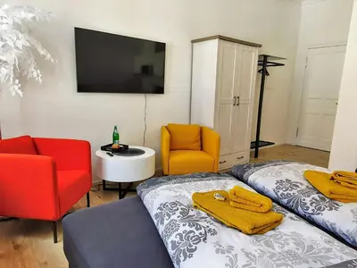 Ein Bett oder Betten in einem Zimmer der Unterkunft Hogulu - im Herzen der Altstadt, Appartement 11