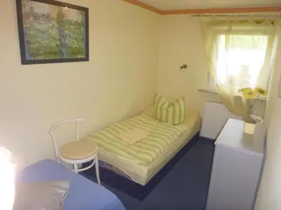 Ein Bett oder Betten in einem Zimmer der Unterkunft Berlin Urlaub im Grünen