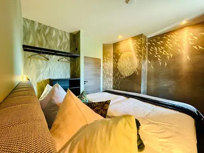 Ein Bett oder Betten in einem Zimmer der Unterkunft Deluxe Apartment im Grünen mit Balkon und Frühstück im Hotel Reindahls
