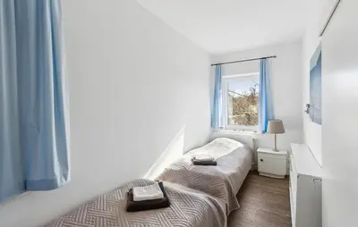 Ein Bett oder Betten in einem Zimmer der Unterkunft Maritim 2