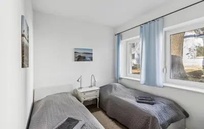 Ein Bett oder Betten in einem Zimmer der Unterkunft Nordisch
