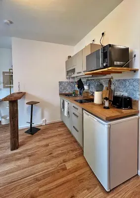 Küche/Küchenzeile in der Unterkunft Das Jaartn - Boardinghouse Appartements & Ferienwohnung