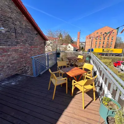Ein Balkon oder eine Terrasse in der Unterkunft Das Jaartn - Boardinghouse Appartements & Ferienwohnung