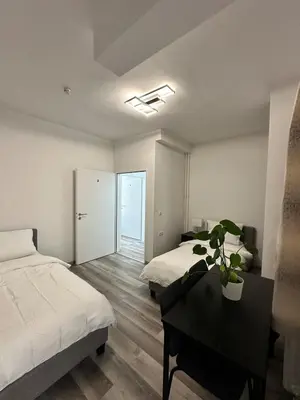 Ein Bett oder Betten in einem Zimmer der Unterkunft Damaschke Apartment 1 Kurfürstendamm