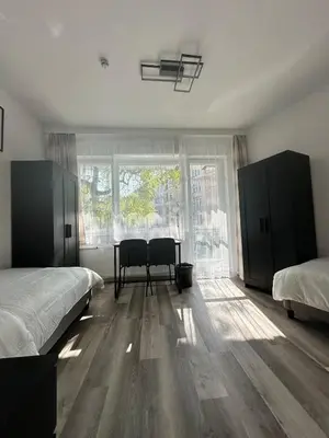 Ein Bett oder Betten in einem Zimmer der Unterkunft Damaschke Apartment 1 Kurfürstendamm