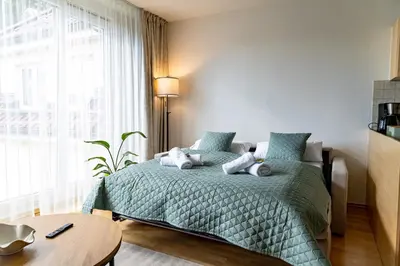 Ein Bett oder Betten in einem Zimmer der Unterkunft MAVA Homes Apartments