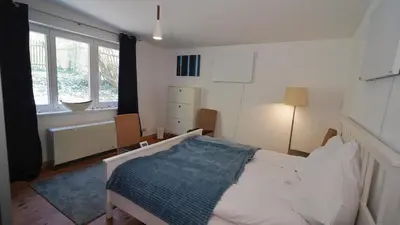 Ein Bett oder Betten in einem Zimmer der Unterkunft Gartenhaus in Potsdam Wilhelmshorst