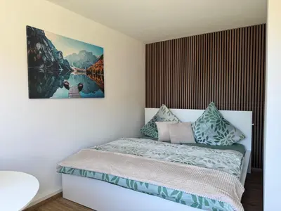 Ein Bett oder Betten in einem Zimmer der Unterkunft Ferienwohnung im Haus am See