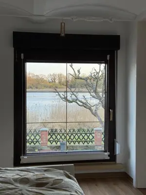 Ein Bett oder Betten in einem Zimmer der Unterkunft Ferienwohnung im Haus am See