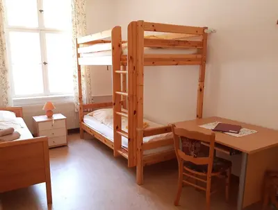 Ein Bett oder Betten in einem Zimmer der Unterkunft Die Malche Gäste und Tagungshaus 17