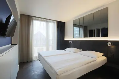 Ein Bett oder Betten in einem Zimmer der Unterkunft Hotel AMANO Grand Central