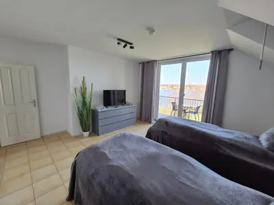 Ein Bett oder Betten in einem Zimmer der Unterkunft Monteurzimmer 1 mit Seeblick