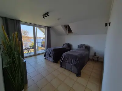 Ein Bett oder Betten in einem Zimmer der Unterkunft Monteurzimmer 1 mit Seeblick
