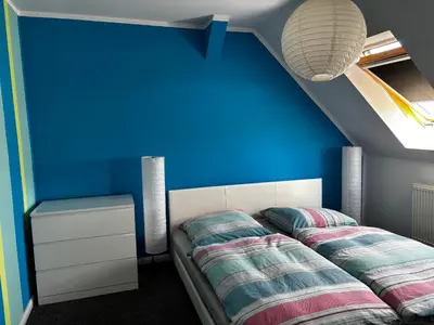 Ein Bett oder Betten in einem Zimmer der Unterkunft Ferienhaus am Friedenshain