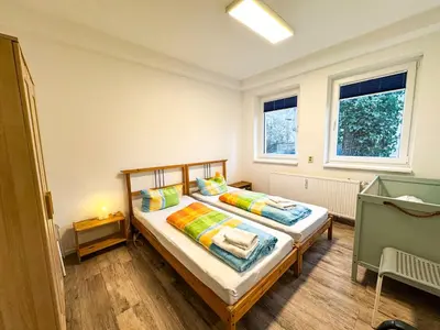 Ein Bett oder Betten in einem Zimmer der Unterkunft Ferienwohnungen Grabbeallee Three