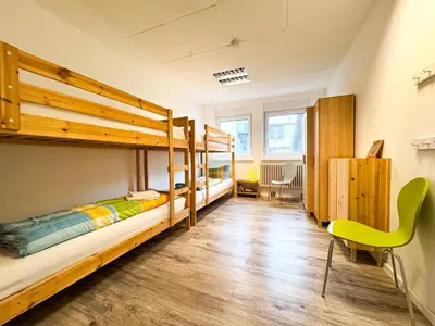 Ein Bett oder Betten in einem Zimmer der Unterkunft Ferienwohnungen Grabbeallee Three