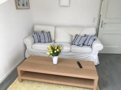 Ein Sitzbereich in der Unterkunft Ferienwohnungen Grabbeallee Two