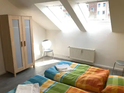 Ein Bett oder Betten in einem Zimmer der Unterkunft Ferienwohnungen Grabbeallee Two