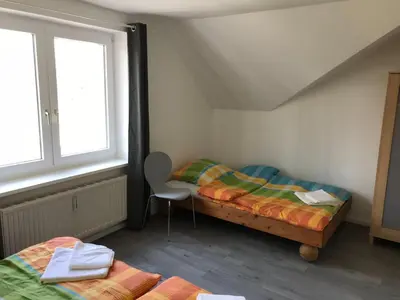 Ein Bett oder Betten in einem Zimmer der Unterkunft Ferienwohnungen Grabbeallee Two
