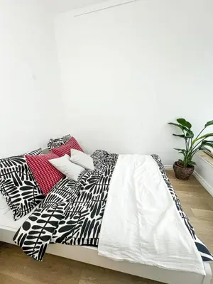 Ein Bett oder Betten in einem Zimmer der Unterkunft Familystay am Botanischen Garten