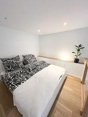 Ein Bett oder Betten in einem Zimmer der Unterkunft Familystay am Botanischen Garten