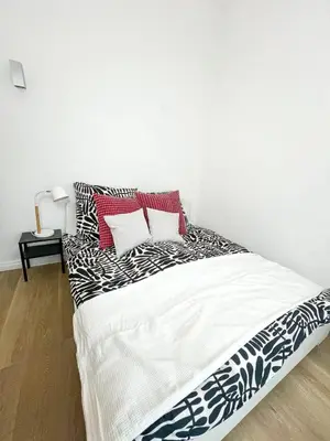 Ein Bett oder Betten in einem Zimmer der Unterkunft Familystay am Botanischen Garten