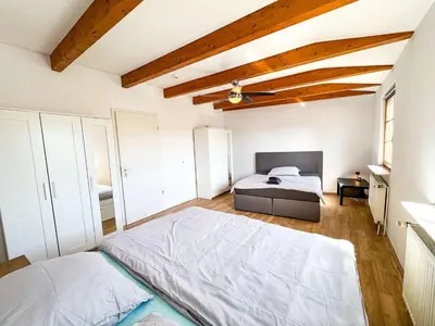 Ein Bett oder Betten in einem Zimmer der Unterkunft Large Apartment for Large Groups south of Berlin