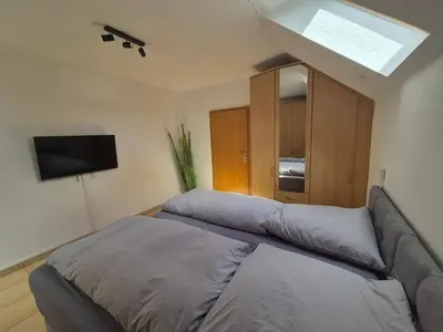 Ein Bett oder Betten in einem Zimmer der Unterkunft Monteurzimmer 4 am See mit Garten
