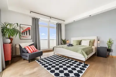 Ein Bett oder Betten in einem Zimmer der Unterkunft Urban Loft - 180 Skyline Balkon - 2 SZ - HBF