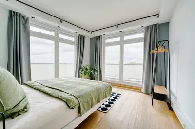 Ein Bett oder Betten in einem Zimmer der Unterkunft BIG Urban Loft - bis zu 20 Personen - 180qm - 180 Grad Skyline Balkon