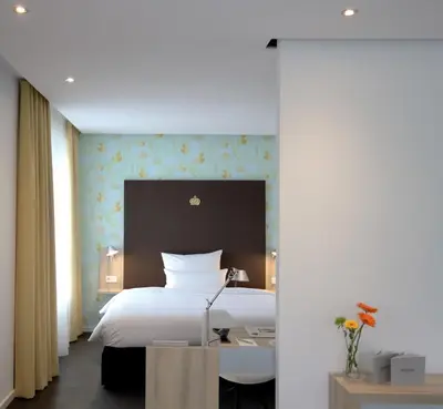 Ein Bett oder Betten in einem Zimmer der Unterkunft Grimm's Potsdamer Platz
