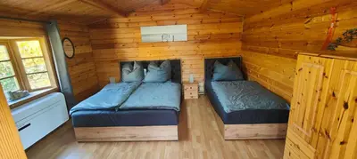 Ein Bett oder Betten in einem Zimmer der Unterkunft Ferienhaus Im Wäldchen in See Nähe