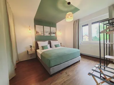 Ein Bett oder Betten in einem Zimmer der Unterkunft Neu! Spreelounge Apartments! Ihre Auszeit im Herzen des Spreewalds