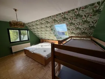 Ein Bett oder Betten in einem Zimmer der Unterkunft Bärenheim