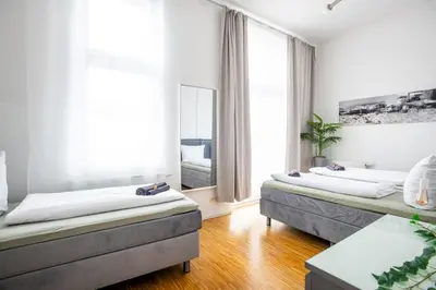 Ein Bett oder Betten in einem Zimmer der Unterkunft SC 08 by Rockchair l Cozy Apt 3 SZ 2 Bäder Balkon