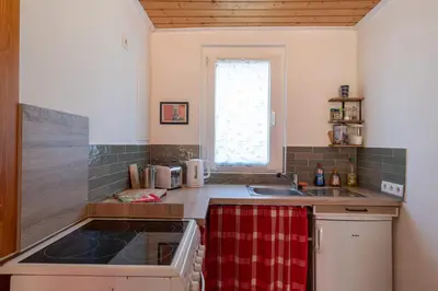 Küche/Küchenzeile in der Unterkunft Ferienhaus Neuland 4 - Entspannung in Seenähe