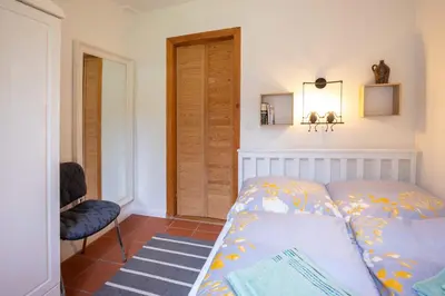 Ein Bett oder Betten in einem Zimmer der Unterkunft Ferienhaus Neuland 4 - Entspannung in Seenähe