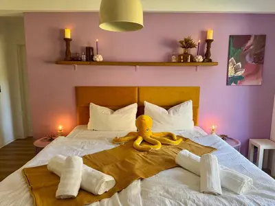 Ein Bett oder Betten in einem Zimmer der Unterkunft FamilienNest XXL - direkt am See