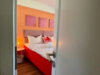Ein Bett oder Betten in einem Zimmer der Unterkunft FamilienNest XXL - direkt am See