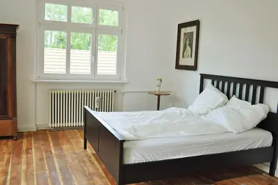 Ein Bett oder Betten in einem Zimmer der Unterkunft Country house villa near Berlin