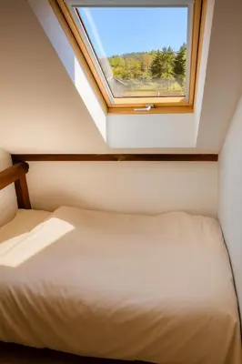 Ein Bett oder Betten in einem Zimmer der Unterkunft Naturidylle mit Kamin und Sauna in der Schorfheide