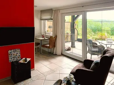 Ein Sitzbereich in der Unterkunft Chalet am See Sader