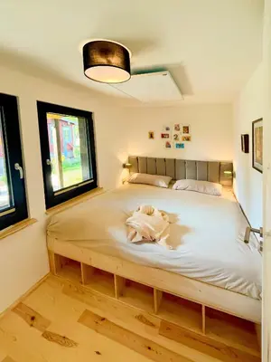Ein Bett oder Betten in einem Zimmer der Unterkunft Haus 1 am Grimnitzsee - erstklassiges Design, mit eigenem Garten und nah am See
