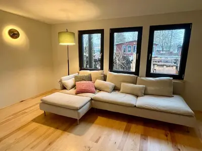 Ein Sitzbereich in der Unterkunft Haus 1 am Grimnitzsee - erstklassiges Design, mit eigenem Garten und nah am See