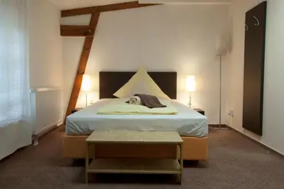 Ein Bett oder Betten in einem Zimmer der Unterkunft Perle Hotel