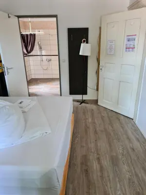 Ein Bett oder Betten in einem Zimmer der Unterkunft Perle Hotel