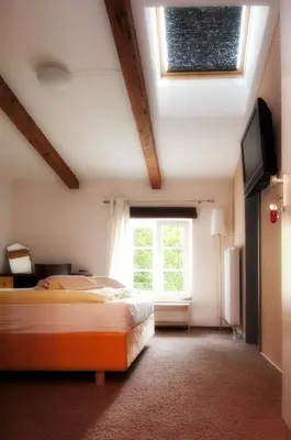 Ein Bett oder Betten in einem Zimmer der Unterkunft Perle Hotel