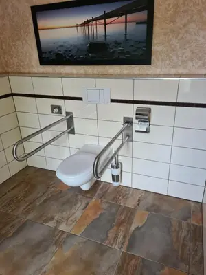 Ein Badezimmer in der Unterkunft Perle Hotel
